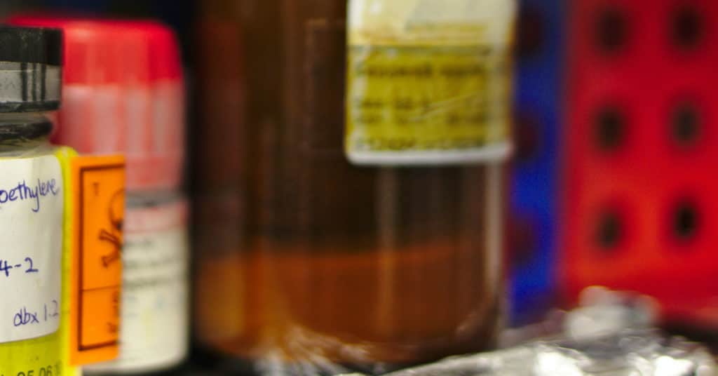 Chemical bottles on shelf | Chemical Exposure