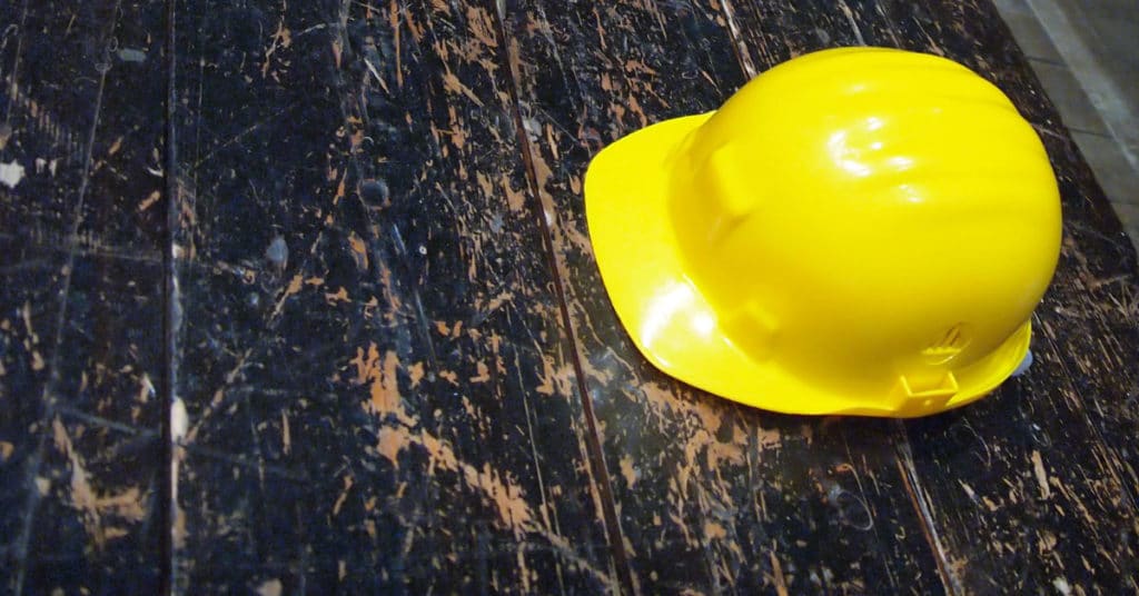 Construction worker's hardhat on floor. | Construction Safety Accidents