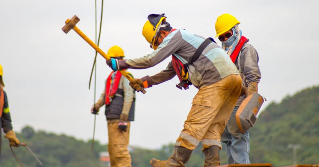 Construction working swinging sledge hammer | On-the-Job-Injury