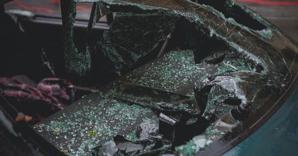 A shattered windshield in a car after a car accident, personal injury claims process