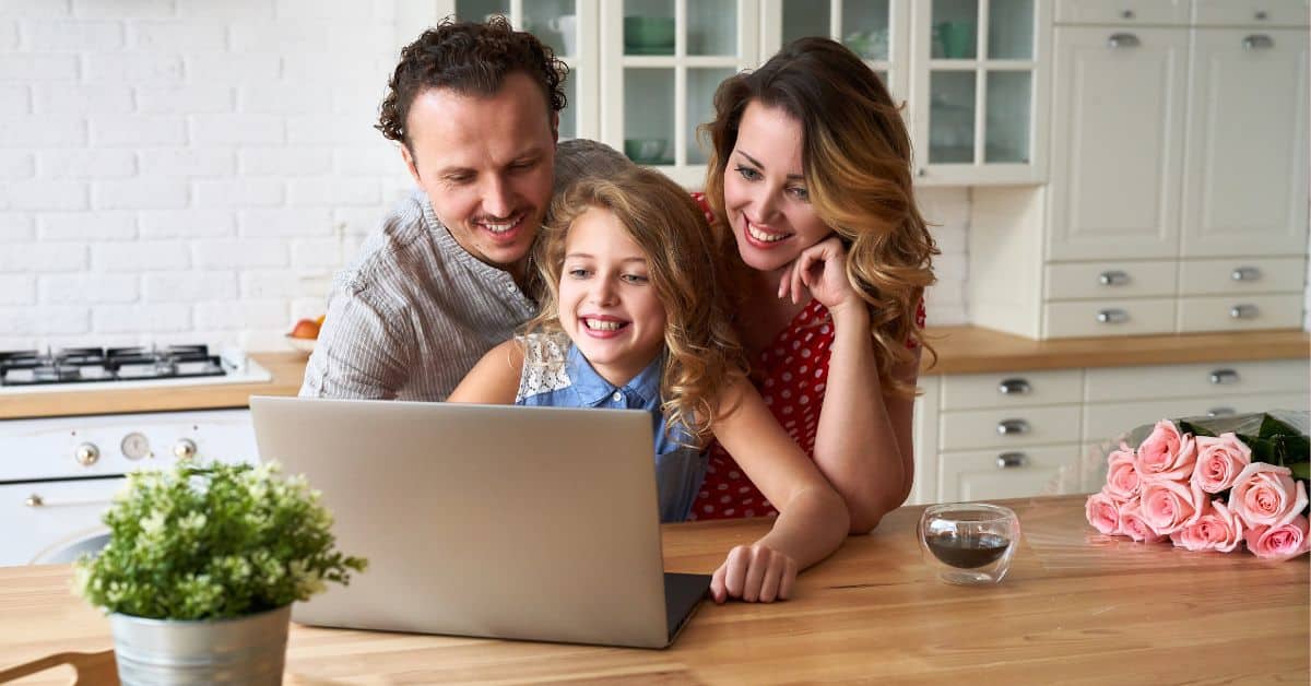 Happy family discussing finances at the kitchen table, estate planning