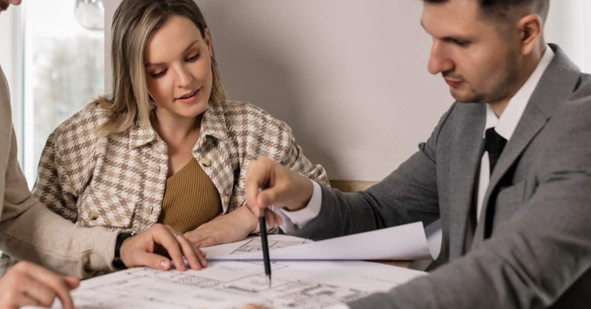 Young woman and estate attorney looking over papers, Debts and Liabilities During Estate Administration