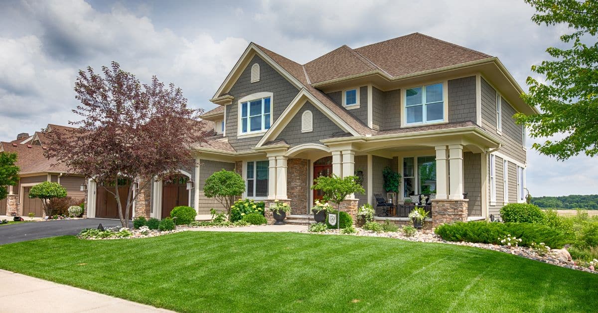 Gray two story house on a sunny day, Review Your Estate Plan