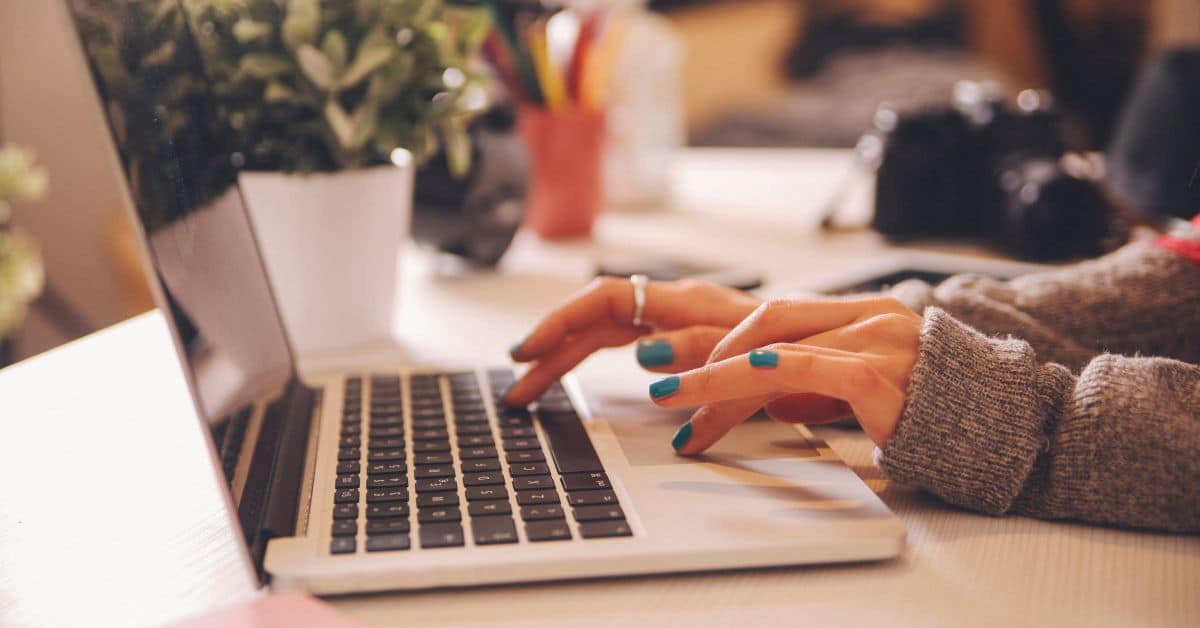 Woman typing on a computer, Digital Assets in Your Estate Plan