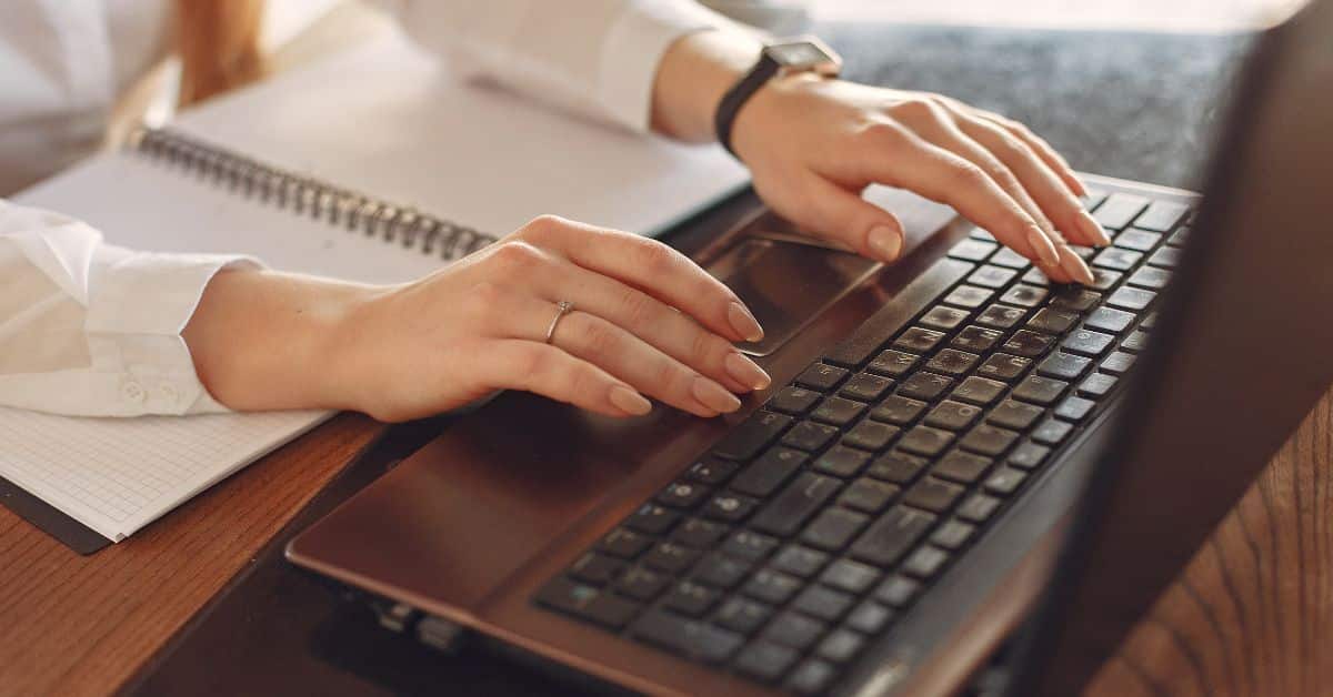 Woman typing on a laptop, Review Your Estate Plan